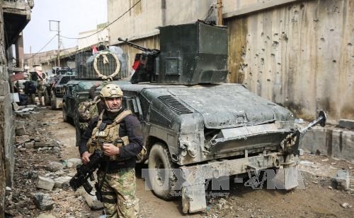 В Мосуле происходят жестокие бои между иракскими силовиками и боевиками ИГ - ảnh 1